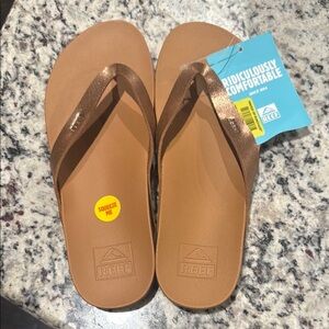 Reef Brown Flip Flops with Shiny Copper Straps